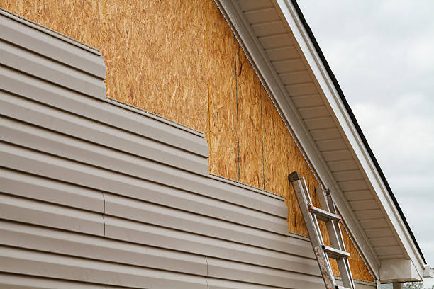 Professional Storm Damage Siding Repair technician working in Odessa, TX